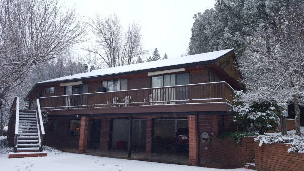 Snowy front of two story red building