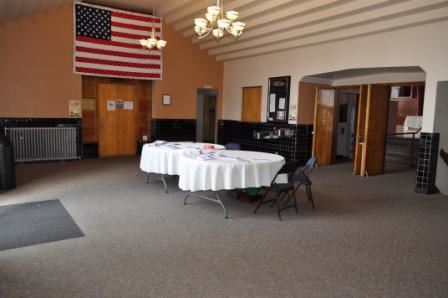 Table Arrangement to welcome guests in foyer for large event at Grass Valley Veterans Building