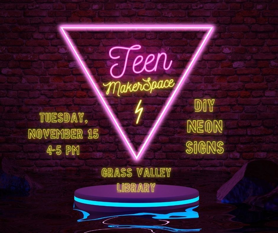 Teen MakerSpace text in neon pink sign against dark background