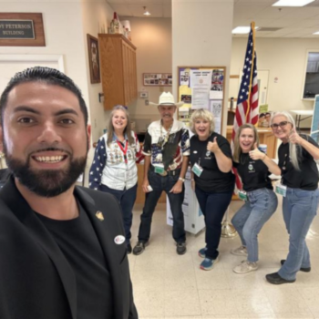 Armando Salud-Ambriz and poll workers
