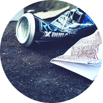 Discarded Can and Napkin on the Ground