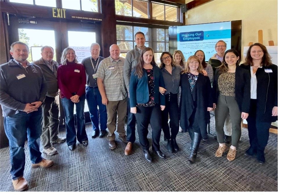 Portrait of a group of people gathered together facing the camera